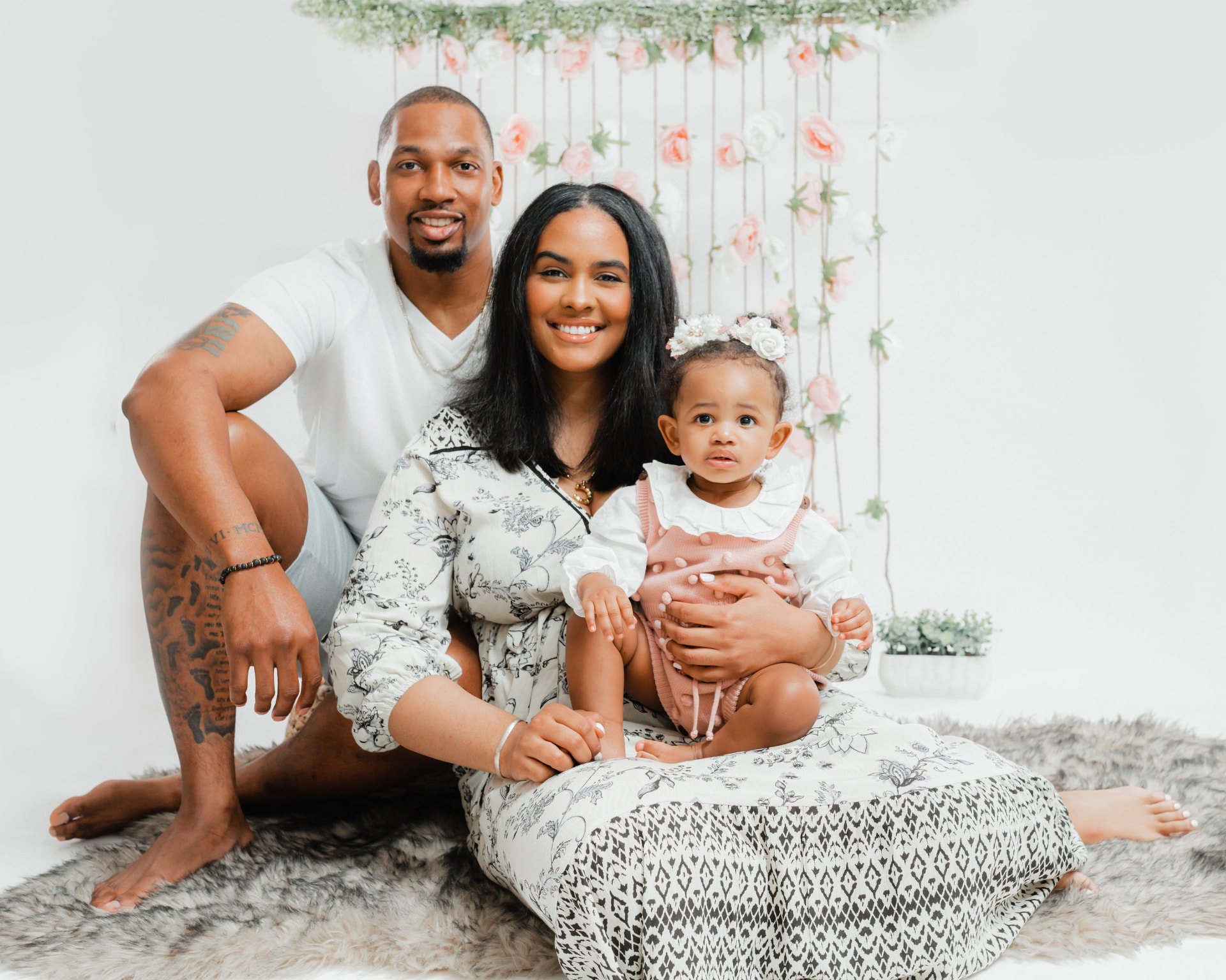 Family portrait against a floral backdrop